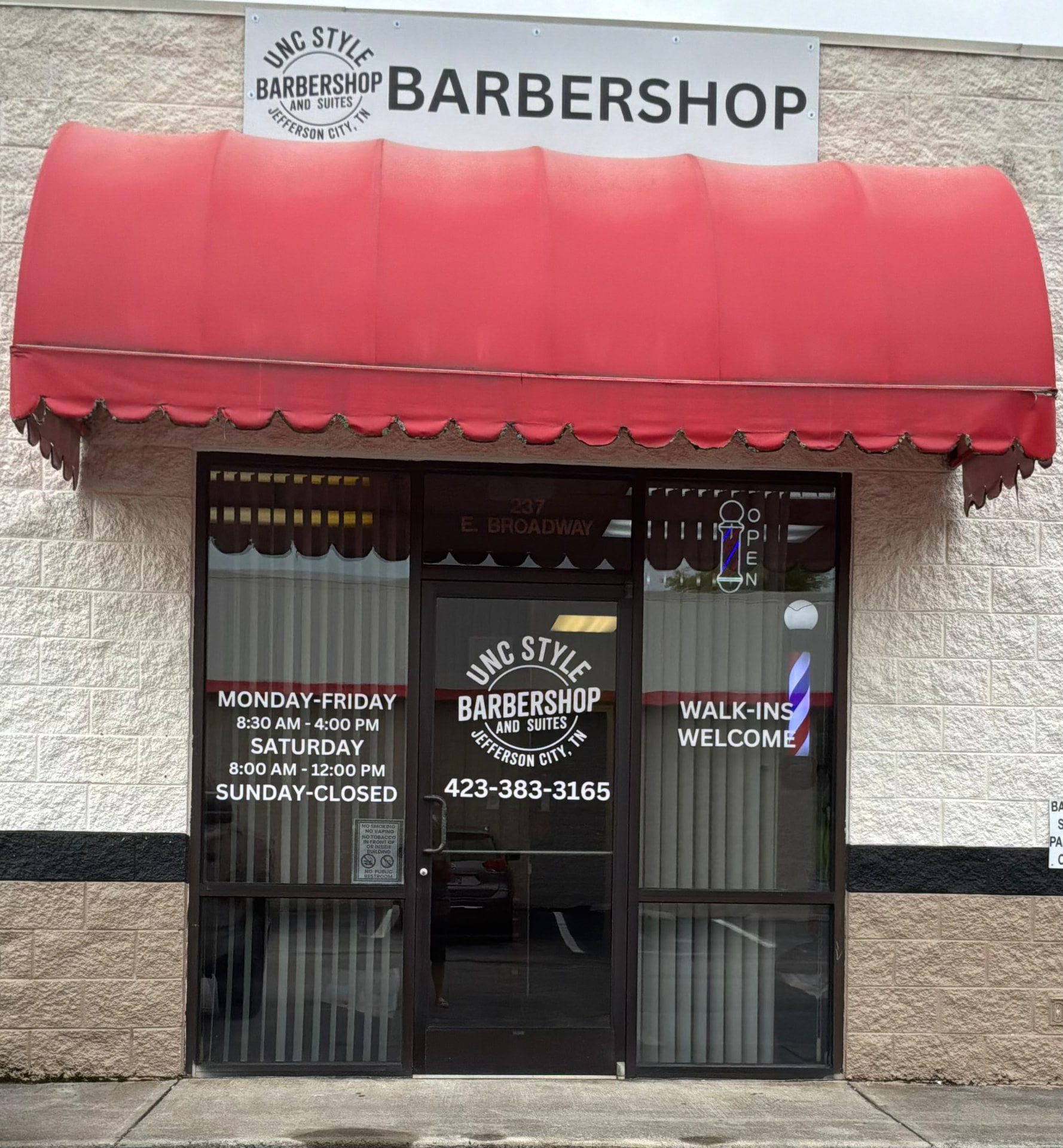 Unc Style Barbershop and Suites storefront with Walk-Ins Welcome sign